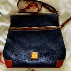 Dooney & Bourke Pebble Grain leather Crossbody bag navy blue & tan trim.